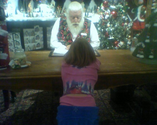 Father Christmas writing my daughter's name on the "Good" list