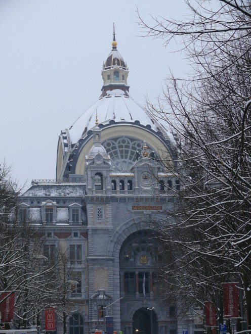 Snow covered Antwerp Central Station as seen from De Keyserlei