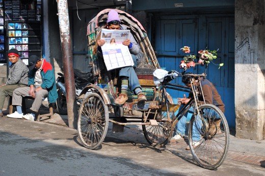 Unproductive Trishaw driver in Thamel enjoying the brief sunshine.
