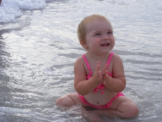 My grandaughter at an Atlantic beach. Photo by Holle Abee.