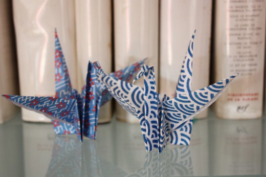 Even paper cranes can be used in a bedroom decorating scheme.