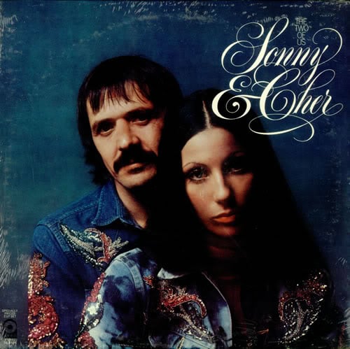 Sonny and Cher posing for the camera together. 
