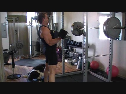 Gregg performing a standing curl. Remember to stay tight and don't "flop". Do the reps in a slow and controlled manner.  Gregg performing a standing curl. Remember to stay tight and don't "flop". Do the reps in a slow and controlled manner.