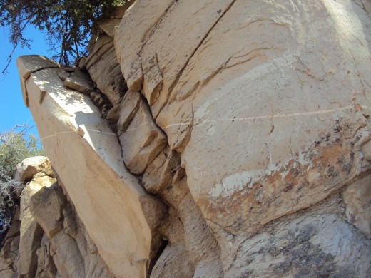 Cracks in between the rocks on the hillside