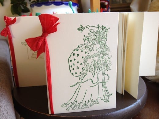 Using cream pre folded card, Chris Cringle stamp, green ink and red raffia.