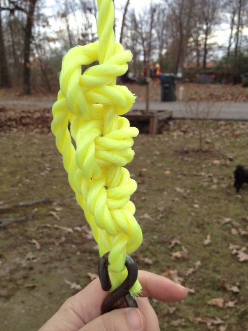 A simple one knot repeated at least 4 times will allow the weight of the swing to tighten the knot over time.