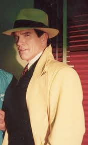 Warren Beatty , as Dick Tracy, wears hat and coat outfit worn by the Gay Senator!  Color change -- dark gray instead of yellow.