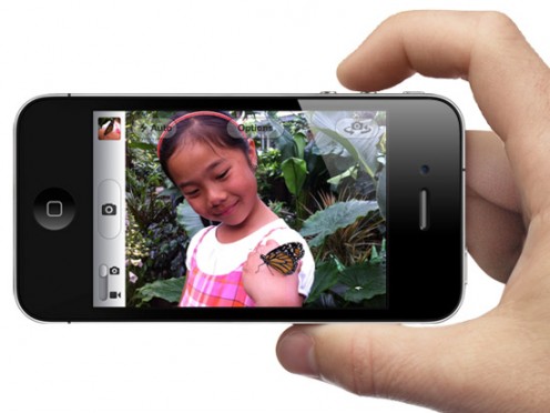 Take pictures using the "Volume Up" button on the edge of your device or on a set of connected headphones with volume controls.