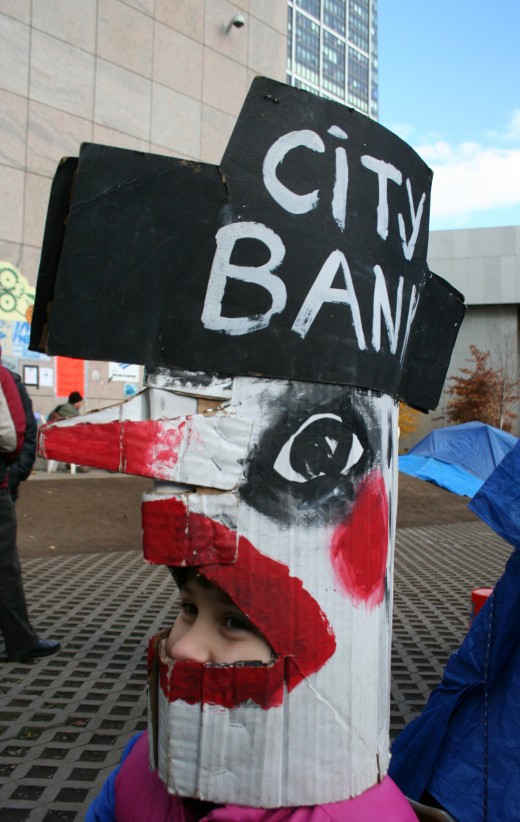 A mask that depicts CitiBank as a chicken (mask courtesy of Bread & Puppets)