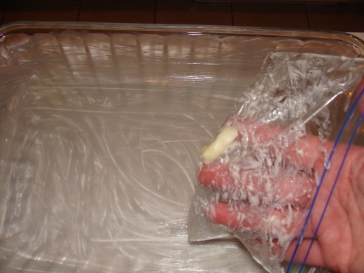 When greasing the pan, use a sandwich bag to keep clean up easy.