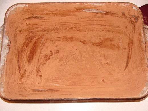Completely dust the pan with flour or cocoa powder.