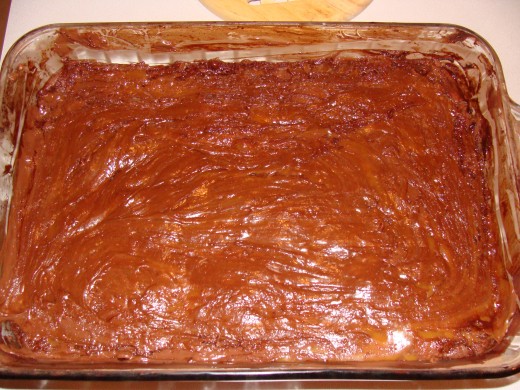 It will become a swirled chocolate, caramel, brownie extravaganza!    Then bake for the remaining time.