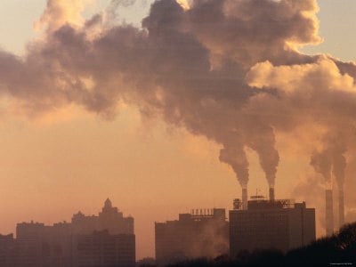 Skyline View of Industrial Factory While Emitting Pollution at Sunset