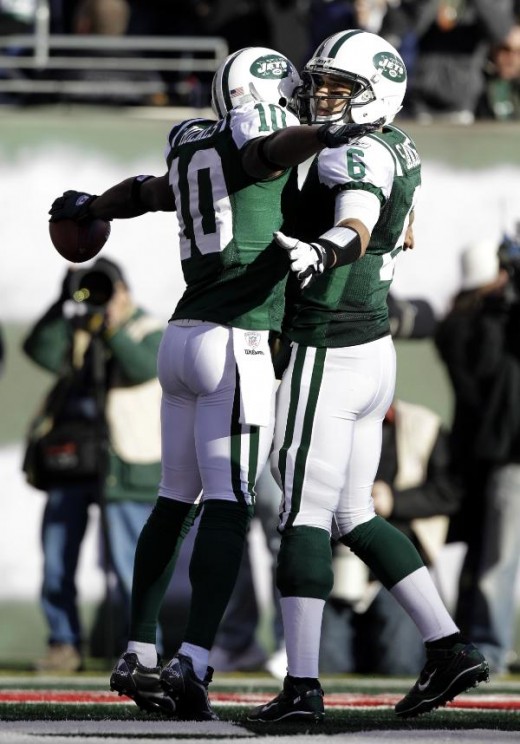 New York Jets' Santonio Holmes, left, celebrates his touchdown with quarterback Mark Sanchez during the second quarter of the NFL football game against the Kansas City Chiefs, Sunday, Dec. 11, 2011, in East Rutherford, N.J. (AP Photo/Kathy Willens)