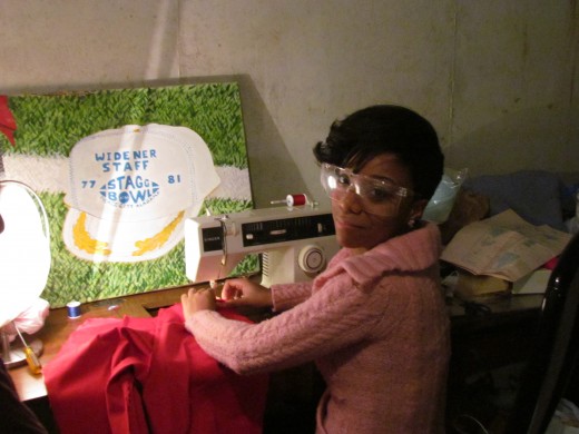 Jaleesa, wears protective goggles as she is instructed by Karen.