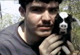 Rodger, 16 with baby Tennessee fainting goat.