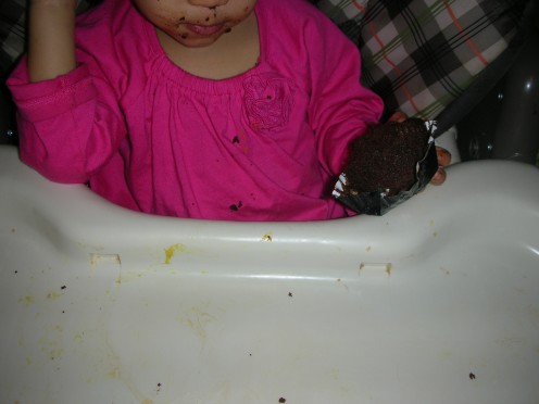 My daughter loving her cupcake