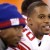 Victor Cruz smiles from the bench during the fourth quarter