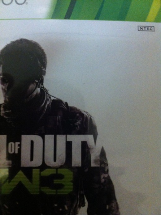 The region code icon is often on the front cover of games. For example, in this image from Call of Duty: Modern Warfare 3, the NTSC logo is in the upper-right corner.