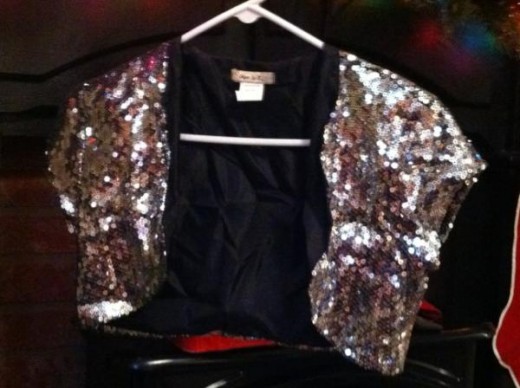 Here's the vest I bought, covered in sequins and already lined it was perfect to turn into a little bag. 