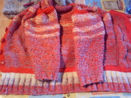 Here is another rectangle based sweater using pink yarn!.  The arms were attached later but the principal is the same.  As she grew, the body was lengthened.