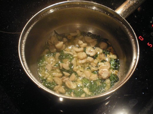 Olive oil, coriander and garlic and the stalks of the mushrooms