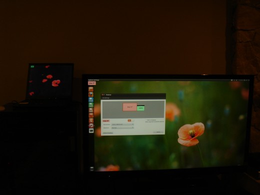 Laptop display along with TV display.