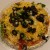 Add the additional toppings like the black olives and green onion. Add the additional toppings like the black olives and green onion.