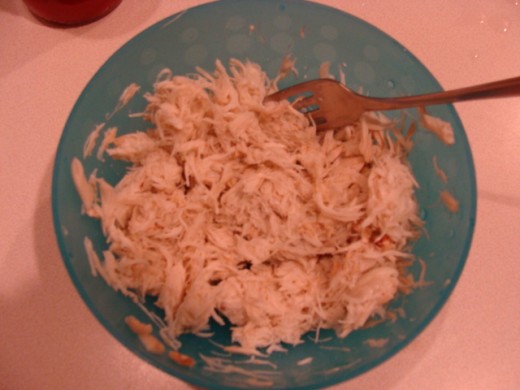Shredding the crab meat.