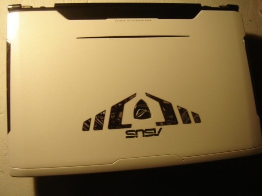 Laptop in white cover.