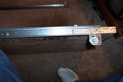 Screw the drawer slides to the sides of the shelf. I use the 5/8 inch screws for a stronger shelf.