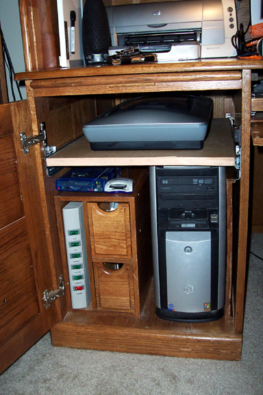 Here's the scanner safely ensconced on the shelf. Very handy. Works great. Gives me enough room to pull out the scanner far enough to open the lid.  Voila'!
