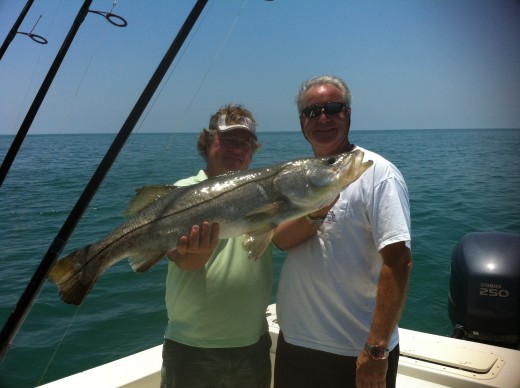 Captain Mike, a big snook, and a very happy angler
