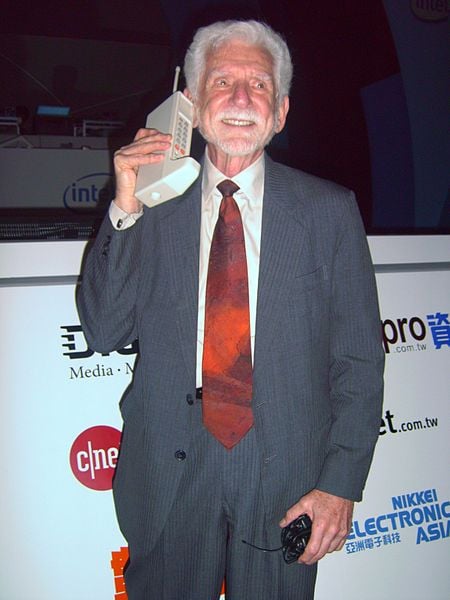 Dr. Martin Cooper of Motorola making a call on his Smartphone in 2007.  This advanced unit won't be out until next year.