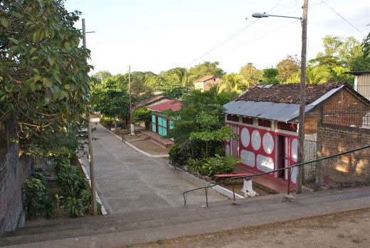 Another view down the street from the Catholic Church showing colorful houses.