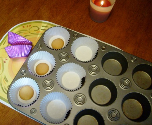 Place cupcake papers in tins.  Add one vanilla wafer or cookie of your choice to bottom of each paper cup.