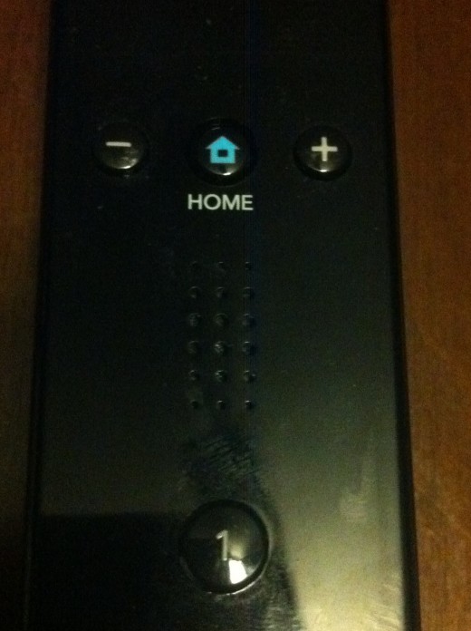The speaker on the Wii Remote is located just beneath the Home button.