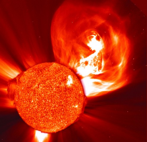 Photo of a solar storm shooting into space.