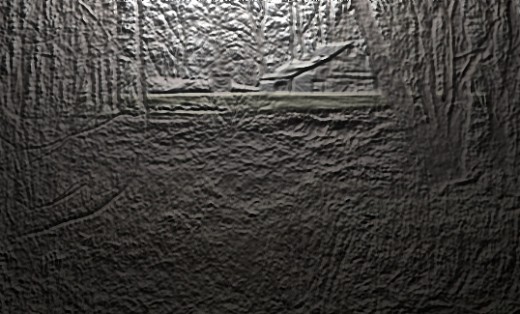 An opening in a stand of trees enabled the photographer to get an amazing shot of a lone house in the woods.  The photo was then enhanced to appear as clay tablet artistry.