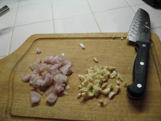 Chopped shallots and garlic for both the risotto and the scallops.