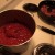 2.  Add the tomatoes, tomato paste, and chicken stock to the stew pot. Then stir.