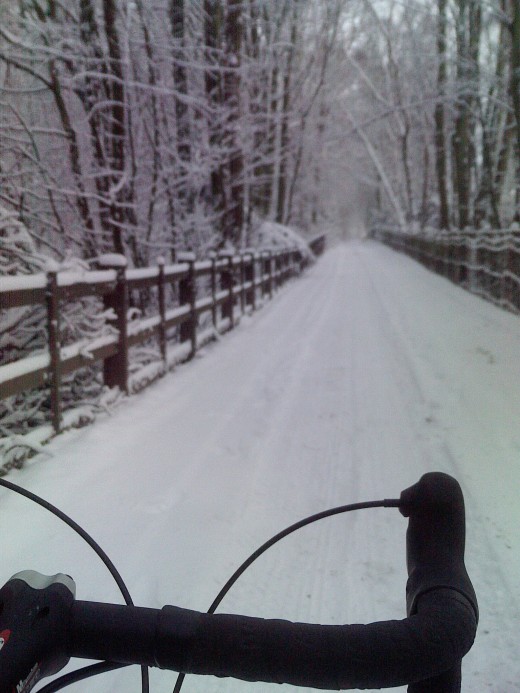 Cycling in the snowr- riding in the snow through Bestwood Country Park. Part of the legendary Sherwood Forest