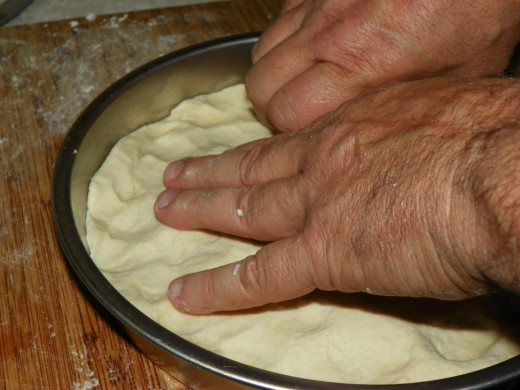 The old 9 inch pie pan trick! Gets your dough flat even and is quick!