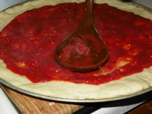 Circle the sauce from the in center out to the crust.