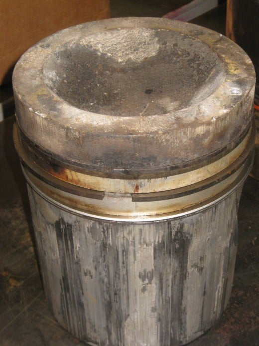 Piston showing detonation damage.