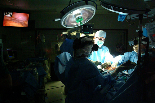 A medical team performs three-dimensional minimally invasive surgery at Walter Reed Army Medical Center in Washington, D.C.