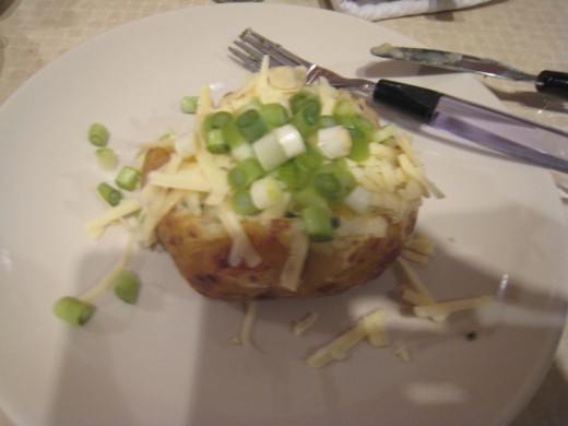 The finished potato: A hot snack stuffed with cheese, chives and chopped spring onions