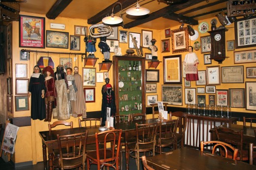 Interior of Poechellekelder Bar with Mannekin Pis costumes, dummies and paraphenalia.