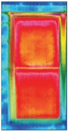 Infrared image of the heat loss through a window - how much money are you losing by heating the outdoors?