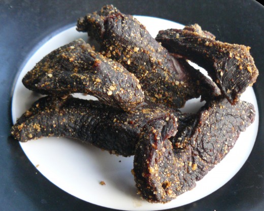 A plate of tasty homemade biltong. You can chew on a stick of biltong or it is more widely eaten in thin slice....